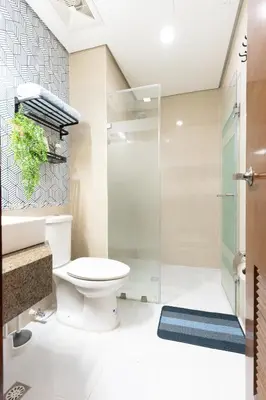 a bathroom with a toilet and a shower at 2mins to Malls, Unli Full Body Massage, Eastwood Le Grand 3 in Manila