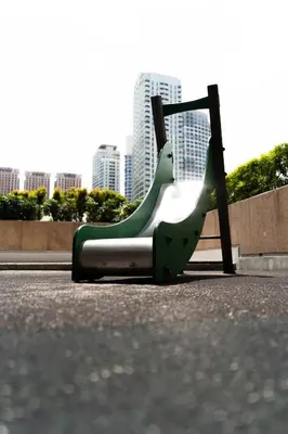 a green and white slide in a park at 2mins to Malls, Unli Full Body Massage, Eastwood Le Grand 3 in Manila