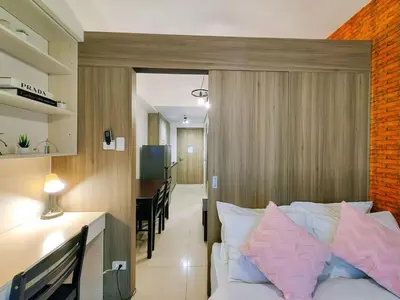 a bedroom with a bed and a desk and a dining room at 1BR Condotel with Balcony at FAME Residences #FM04-1 in Manila