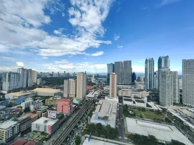 a view of a city with tall buildings at 1BR Condotel with Balcony at FAME Residences #FM05-1 in Manila