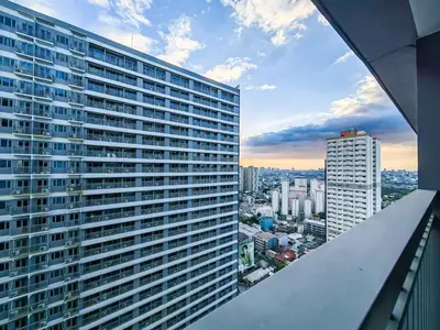 a view of a large building in a city at 1BR Condotel with Balcony at FAME Residences #FM14-1 in Manila