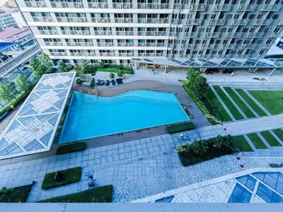 an overhead view of a swimming pool in a building at 1BR Condotel with Balcony at FAME Residences #FM17-1 in Manila