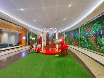 a room with a roller coaster in a lobby at 1BR Condotel with Balcony at FAME Residences #FM17-1 in Manila