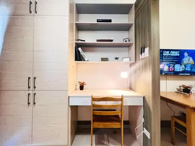 a study room with a desk and a chair at 1BR Condotel with Balcony at FAME Residences #FM18-1 in Manila