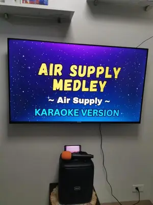 a sign on a wall that reads air supply needle air supply karaoke convention at Mall of Asia condotel shore 3 residence 3 in Manila
