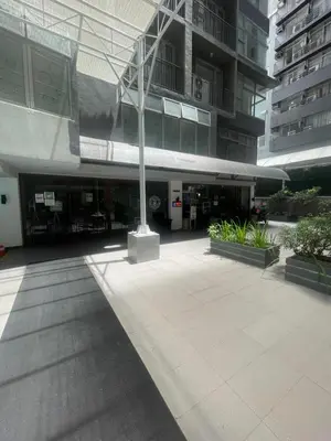 a building with a pole in the middle of a courtyard at Makati City The Serenity Tower 2512A in Manila