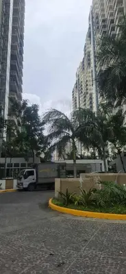 a white van parked in a parking lot with palm trees at House of Lilith at Kasara in Manila