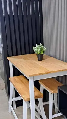a wooden table with a potted plant sitting on it at House of Lilith at Kasara in Manila
