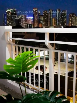 a view of a city skyline from a balcony at Casa Del Sol Staycation in Manila