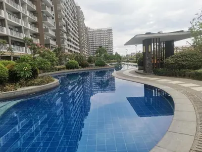 a swimming pool in the middle of a building at Casa Del Sol Staycation in Manila