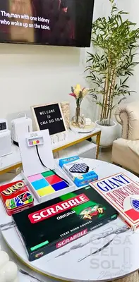 a table with some books on top of it at Casa Del Sol Staycation in Manila
