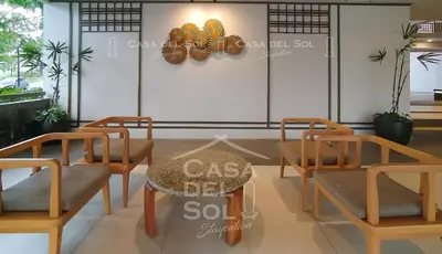a group of chairs and a table in a room at Casa Del Sol Staycation in Manila