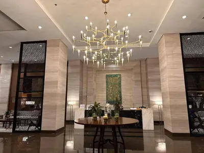 a large lobby with a chandelier and a table at Close dont book in Manila