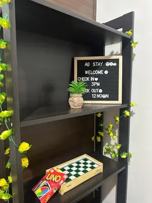 a black shelf with a chess board and a sign at SMDC AIR Residences in Manila