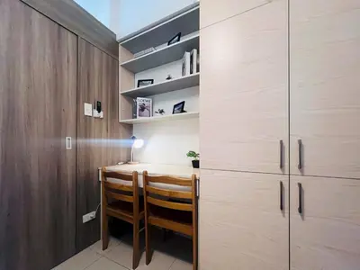 a dining room with a table and some shelves at 1BR Condotel with Balcony at FAME Residences #FM20-1 in Manila