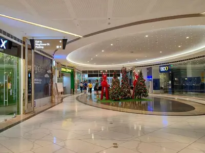 a shopping mall with christmas trees in the middle at 1BR Condotel with Balcony at FAME Residences #FM21-1 in Manila
