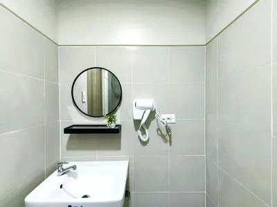 a white bathroom with a sink and a mirror at 1BR Condotel with Balcony at FAME Residences #FM24-1 in Manila