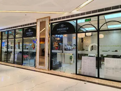 a store front with glass doors in a shopping mall at 1BR Condotel with Balcony at FAME Residences #FM25-1 in Manila