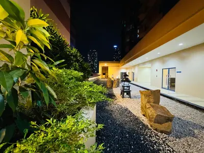 a lobby of a building at night with plants at \u5eb7\u5bbf \u89c0\u703e\u9f4b Guan Lanzhai Studio in Sampong