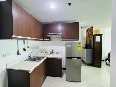 a kitchen with a sink and a refrigerator at \u5eb7\u5bbf \u6674\u7a97\u5c45 Bright Window Room in Sampong