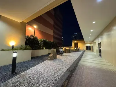 an empty hallway of a building at night at \u5eb7\u5bbf \u6674\u7a97\u5c45 Bright Window Room in Sampong