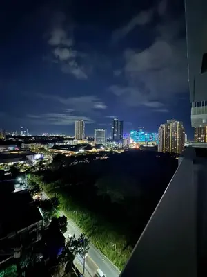 a view of a city at night at Reign Escape in Manila