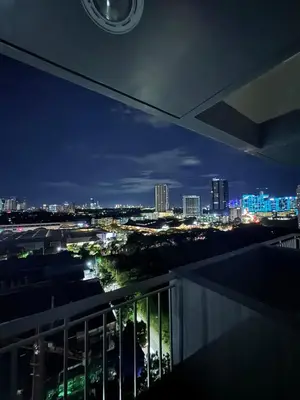 a view of a city skyline at night at Reign Escape in Manila