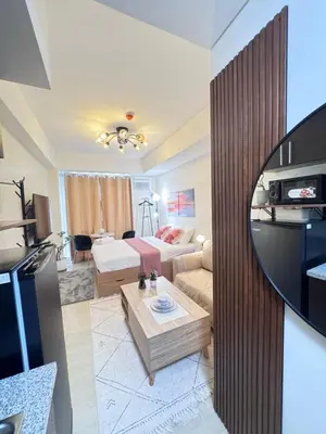 a living room with a couch and a table at The Fresh Escape 2 in Manila