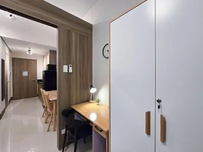 a small apartment with a desk and a dining room at 1BR Condotel with Balcony at FAME Residences #FM32-1 in Manila