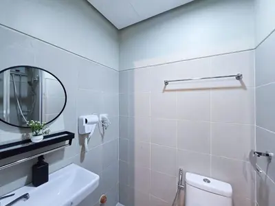 a bathroom with a sink and a toilet and a mirror at 1BR Condotel with Balcony at FAME Residences #FM34-1 in Manila