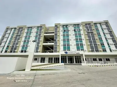 a large building with a lot of windows at Casa Gianna at Berkeley Suites, South Forbes in Silang