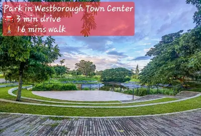 a park in westbrook town center with a pond and trees at Casa Gianna at Berkeley Suites, South Forbes in Silang