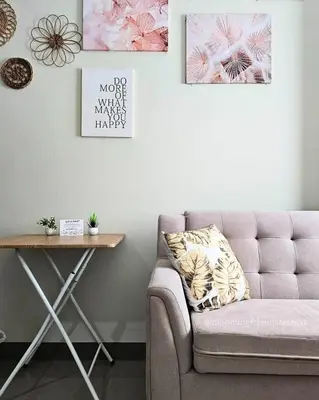 a living room with a couch and a table at Blooming Friends Retreat in Manila