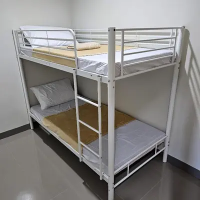 a couple of bunk beds in a room at Blooming Friends Retreat in Manila