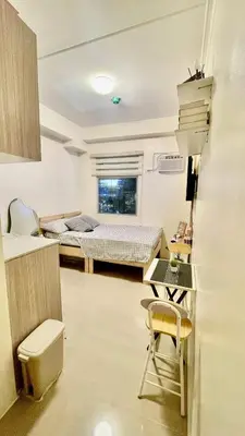 a hospital room with two beds and a desk at The Cozy Fabb in Manila