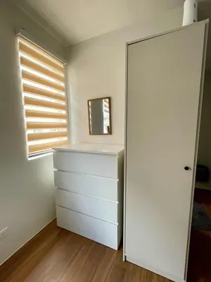 a room with a white dresser and a window at Warm Modern Condo Apartment with Pool & Balcony - East Residences Ortigas Pasig City in Manila