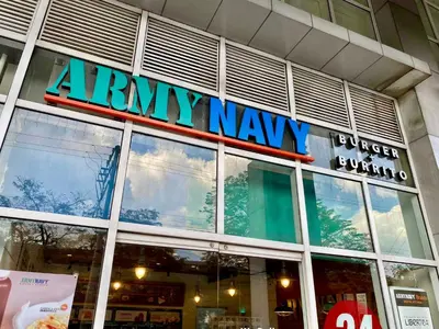 a sign on the front of a army navy store at Spacious 2br condo at Quezon City Mezza Residences 1 in Manila