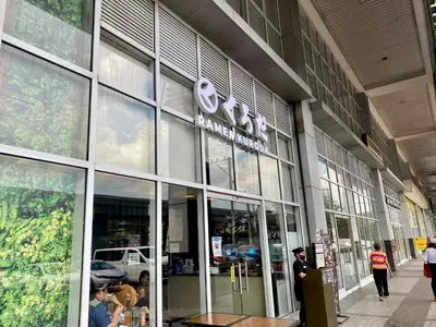 a store front of a building with people walking outside at Spacious 2br condo at Quezon City Mezza Residences 1 in Manila