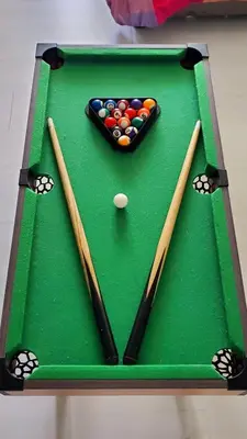 a green pool table with cue balls and chopsticks at Azurejulz Dream Staycation in Manila