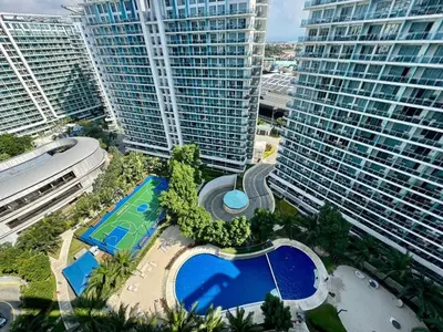 an aerial view of a large building with a pool at SM Bicutan Escape Staycation in Manila