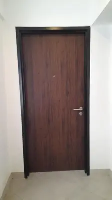 a wooden door in a room with a wall at I-LAND Residences Sucat near NAIA w Wifi free parking in Manila