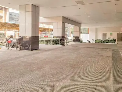 a building with a motorcycle parked inside of it at Cozy Twin Suite with Balcony in Makati Free WiFi in Manila