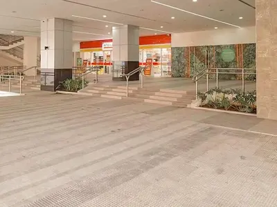 a lobby of a building with a staircase and a lobbyasteryasteryasteryasteryastery at Cozy Twin Suite with Balcony in Makati Free WiFi in Manila