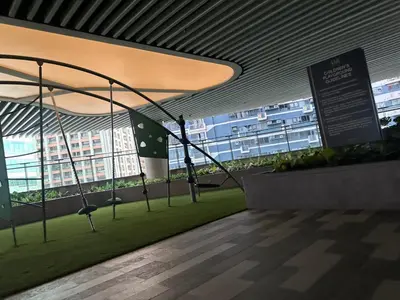a room with a swing in a building with windows at air residences in Manila