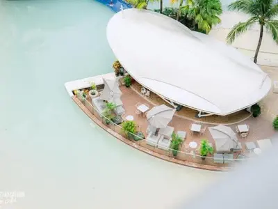 an aerial view of a large building with palm trees at Azure Urban Resorts by Rhome in Manila