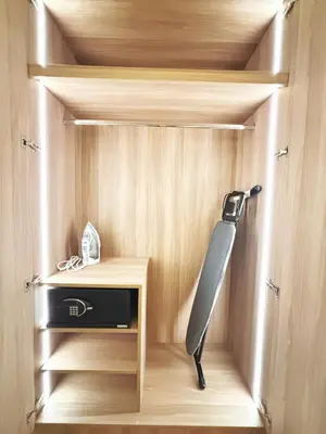 a knife in a small cabinet in a room at The Hotel Residences at Acqua in Manila