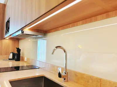 a kitchen with a sink and aaucet at The Hotel Residences at Acqua in Manila