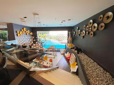 a living room with a view of a pool at The Hotel Residences at Acqua in Manila