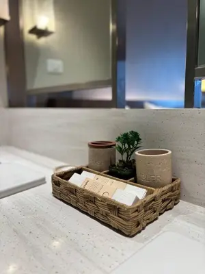 a basket sitting on a counter with a plant in it at The Hotel Residences at Acqua in Manila