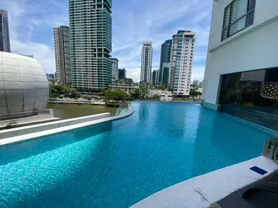 a large swimming pool on the side of a building at The Hotel Residences at Acqua in Manila